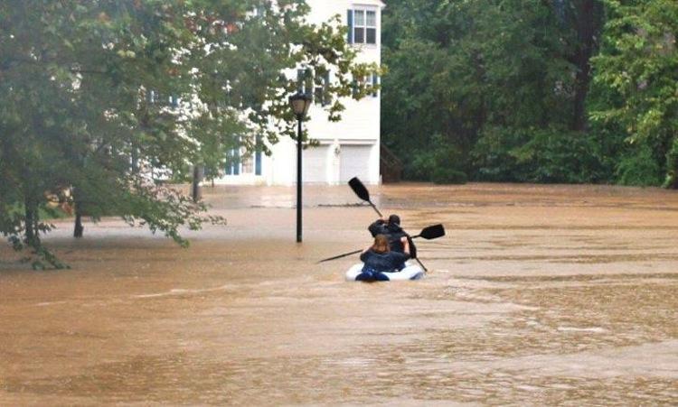 North Springfield residents take advantage of the flooding on September 8 to go kayaking in the street. The flooding caused FCPS to close schools on September 9.