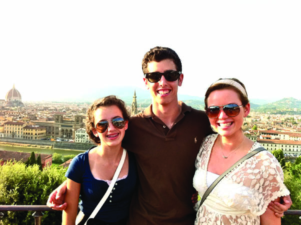 Sophomore Victoria Huenemann stands with brother Adam and sister Rose on their European summer vacation. 