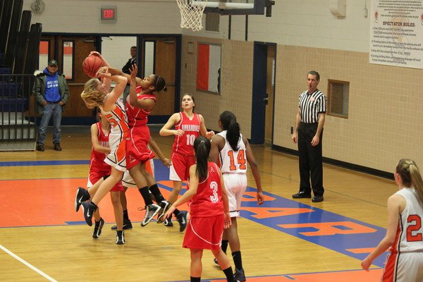 Beathea (left) jumps to block a West Springfield players shot in a game last year 