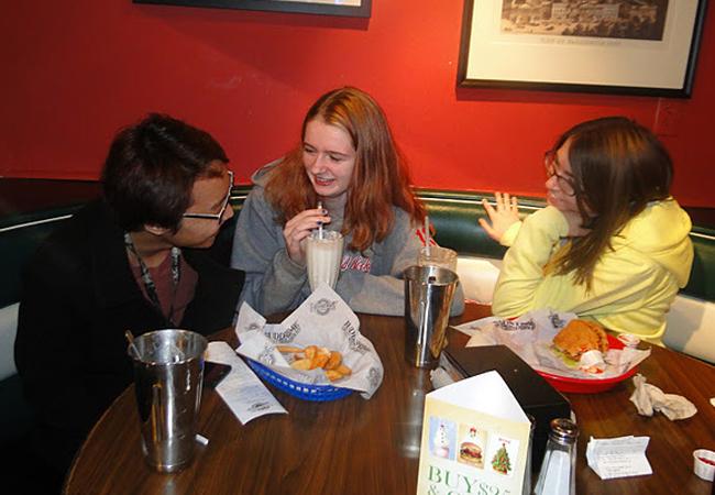 Students enjoy there food at Fuddruckers Night. 