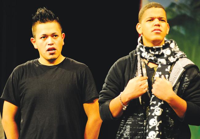 Two students participate in the play. 