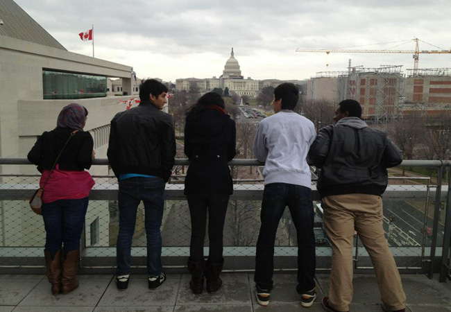 Students look towards the Capital on the terrace of the Newseum. 