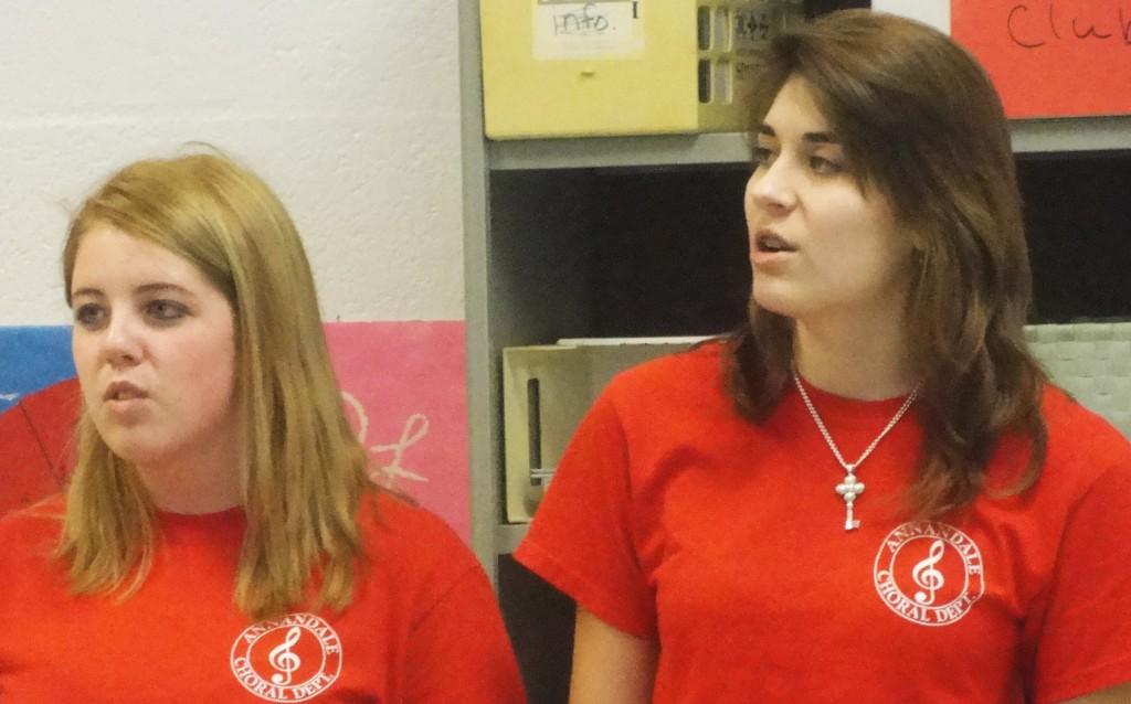 Junior Mairead Kennedy (left) and sophomore Gabi Montes de Oca (right) perform Taylor Swifts Our Song as part of their Singing Valentines performance.