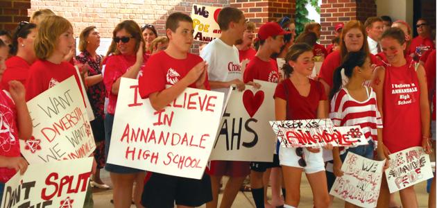 Students from the Wakefield Chapel neighborhood protest the then proposal of removing their neighborhood amid a July 7 public hearing. After a 6-6 vote, which redistricted two neighborhoods, many students who are now assigned to other schools are electing to attend AHS.