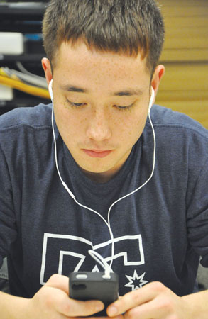 Junior Nick Warner listens to his iPod at an appropriate volume to prevent future permanent damage to his hearing.