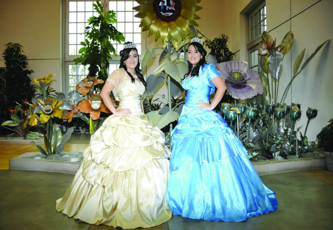 Sophomores Geraldine and Joslin Hoyos pose at the ballroom of their quince before guests arrive