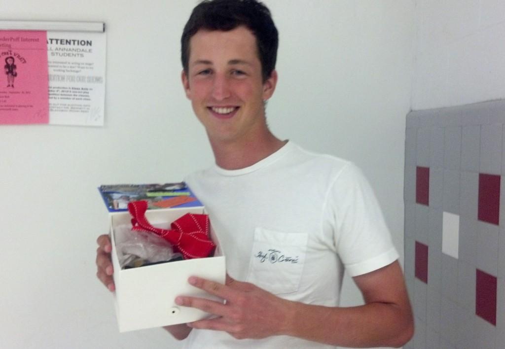 Senior Stephen Oakes holds the box that his girlfriend used to ask him to Homecoming. His girlfriend goes to Marshall HS and had another student bring the box to Oakess R1 where the box would greet him at the start of class. Inside, the couples inside jokes would be written alongside pictures and candy. 