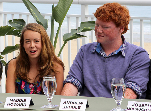 Senior Andrew Riddle (right) sits at one of the first press conferences with fellow cast members for the film.