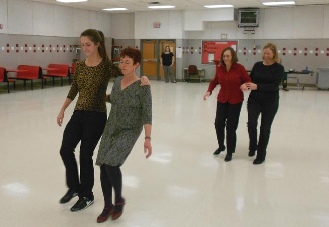 English teacher instructs Scottish dance