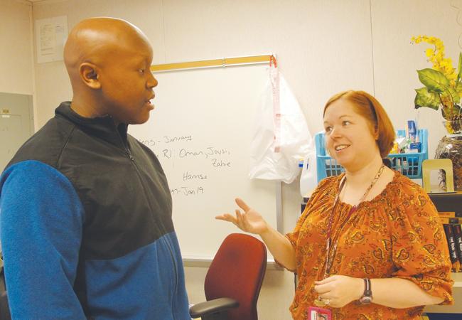 Speech president Michael Bolton and sponsor Lynn Beal discuss impromptu tactics.