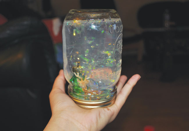 7.) Turn the jar upside down, shake it up, and enjoy your DIY snow globe. Keep it for yourself or give it to someone special.