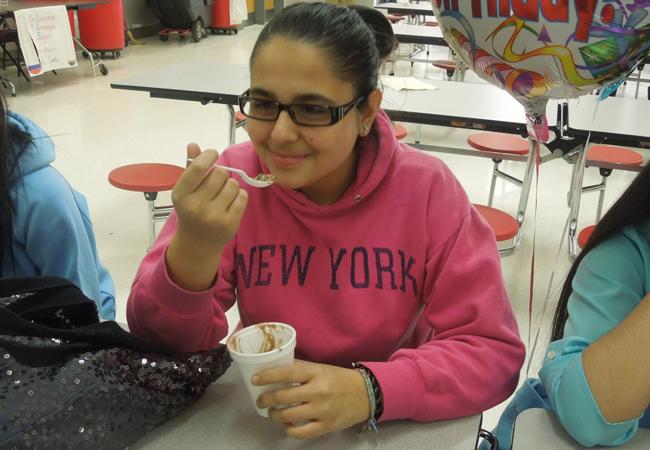 Students enjoying her last bites of ice cream