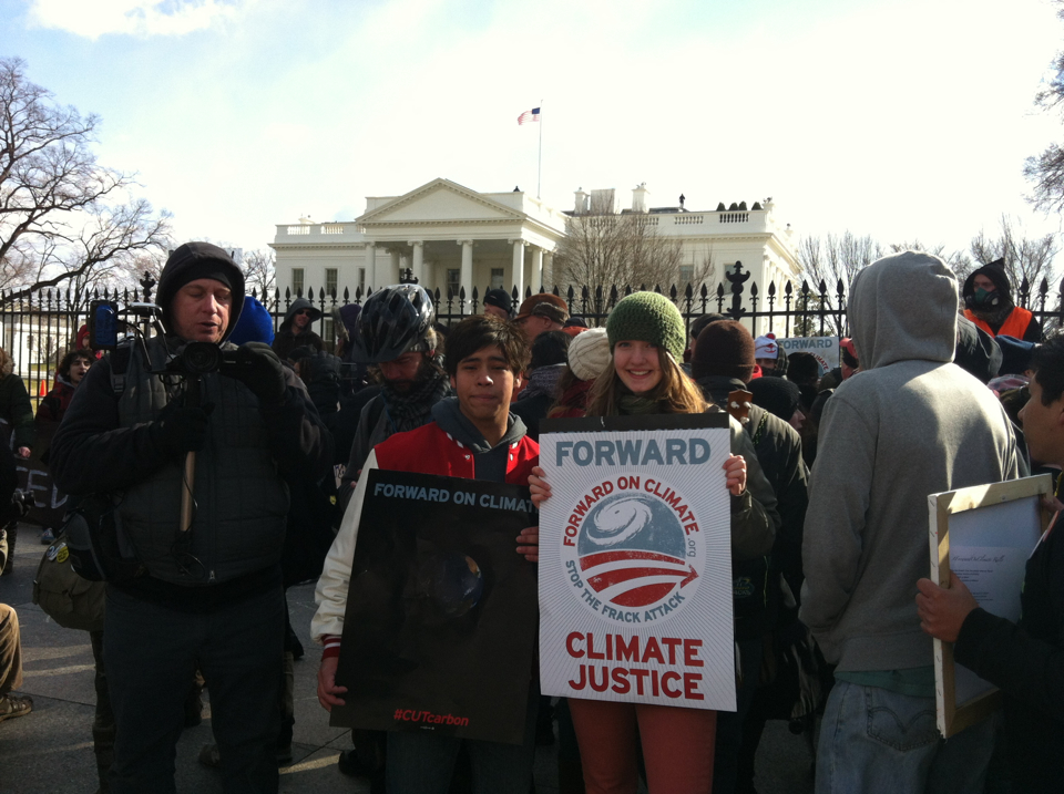 Junior J.C. Clark and sophomore Sarah Metzel hold protest signs in front of the White House as they exercise their constitutional right to freedom of assembly.