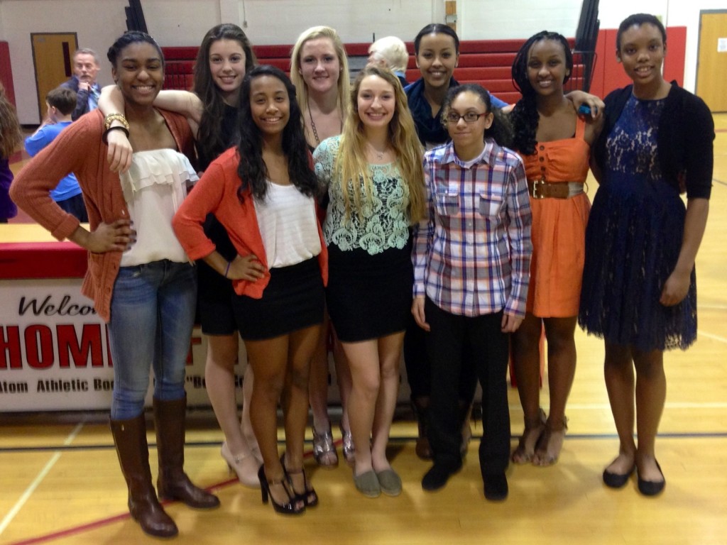 The girls varsity basketball team poses at the banquet.