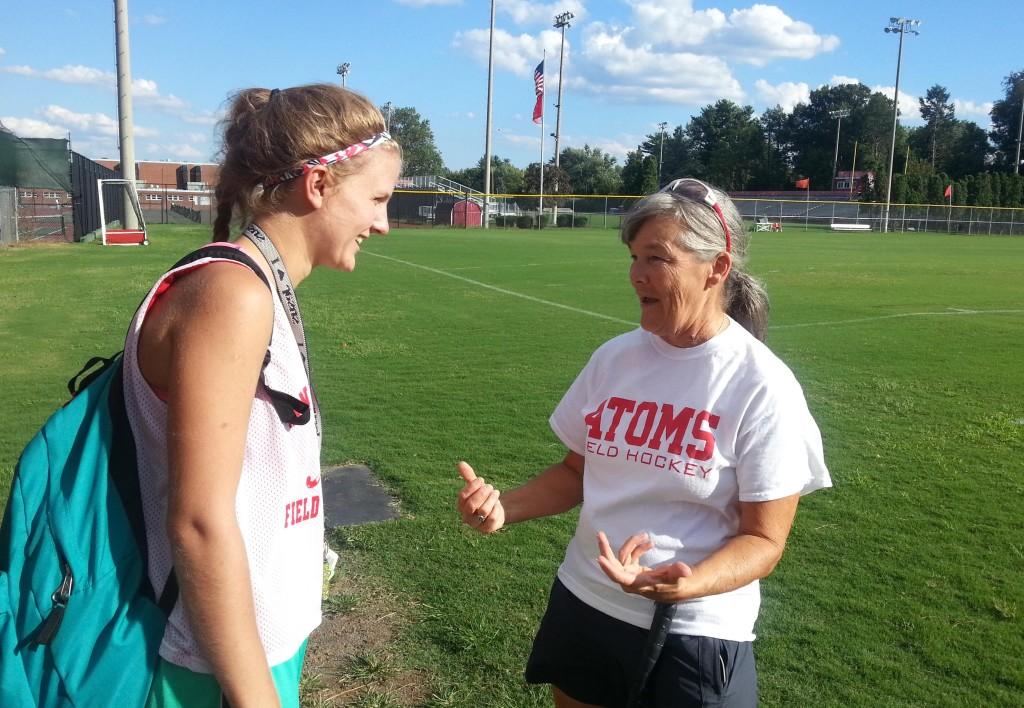 Coach Hook talks with senior captain Katie McCann after practice