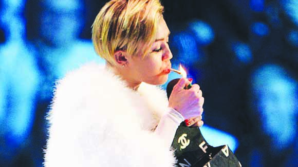 Singer Miley Cyrus has been seen smoking marijuana on stage. 