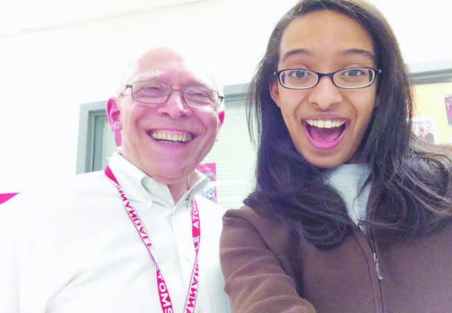 Tamir poses for a selfie with Theory of Knowledge teacher John Hawes.