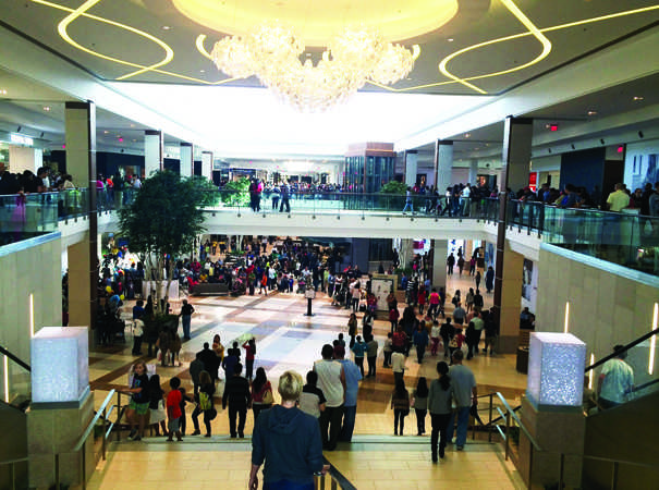 Many people have arrived at the town center and look forward to the new and improved stores and restaurants. Shoppers rush to the opening of Topshop.