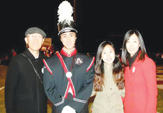 Baek and his family pose for senior night.