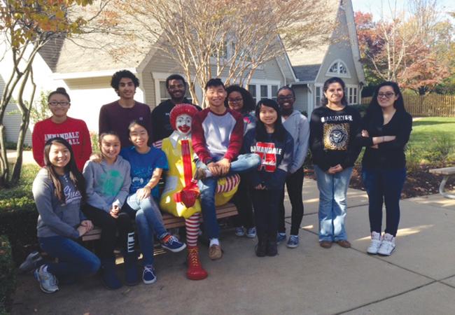 The Atoms Red Cross poses with Ronald in front of the Ronald McDonald House in Fairfax at their recent service event. 