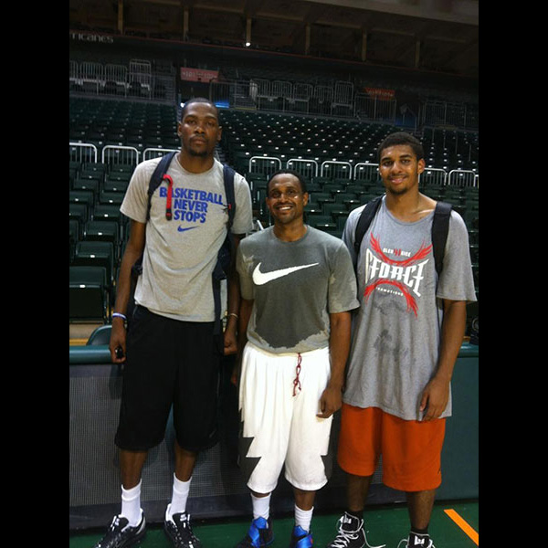 Zormelo (middle) poses with Kevin Durant (left), one of the players that he trains. 