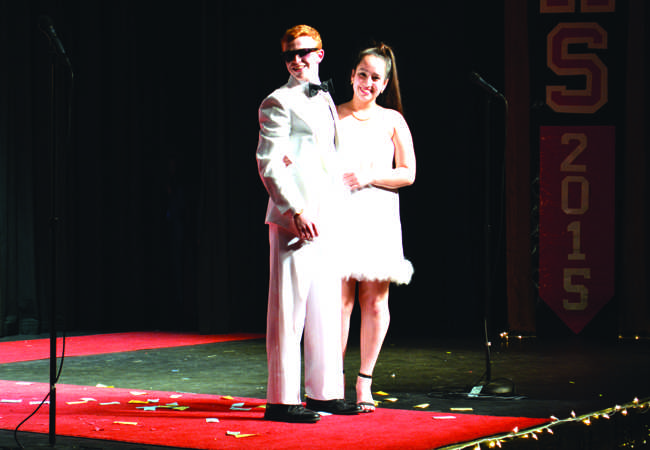 Lamb+and+his+escort%2C+senior+Kaytlin+Hopkins%2C+during+the+Elegance+portion+of+the+competition.+