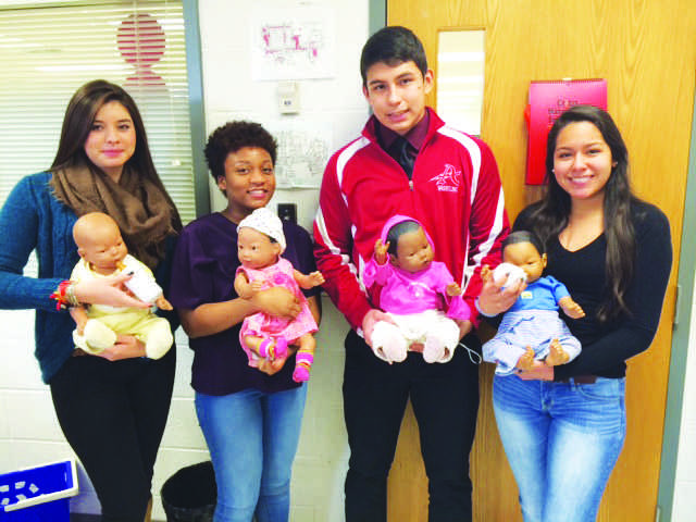 Robin Griffins students holding RealCare babies.