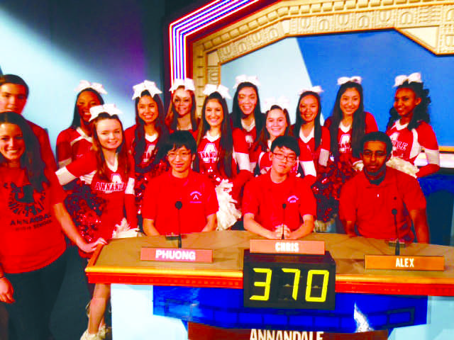 The Its Academic team and the AHS cheer squad pose for a picture in the Its Academic studio 
