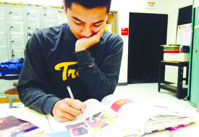 Junior Shawn deLopez brainstorms ideas of what to make, preparing for the contest.