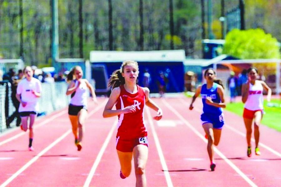 Junior Kelsie Licatovich sprints to the finish line in the 200 meter dash at an invitational meet last year.