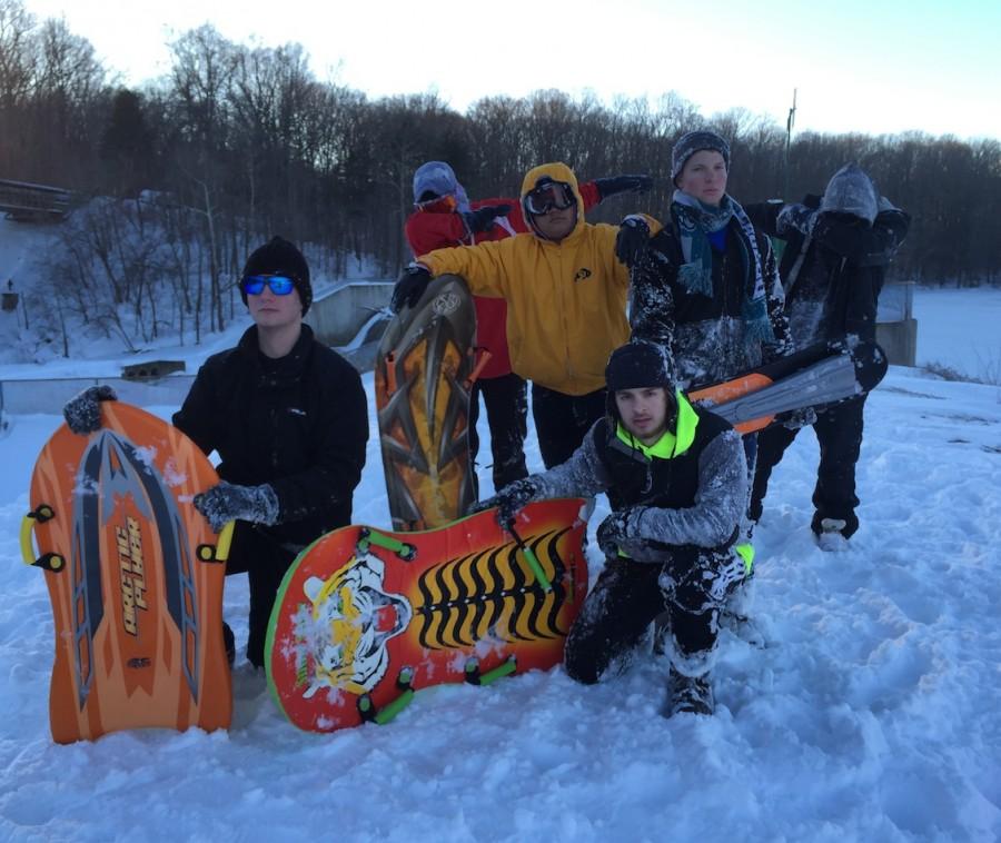 Juniors Matthew Vogus, Tim Gray, Hussein Salem, Conrad Shartel, Brandon Ho and senior Kirk Lindberg pose in the snow during one of their days off. 