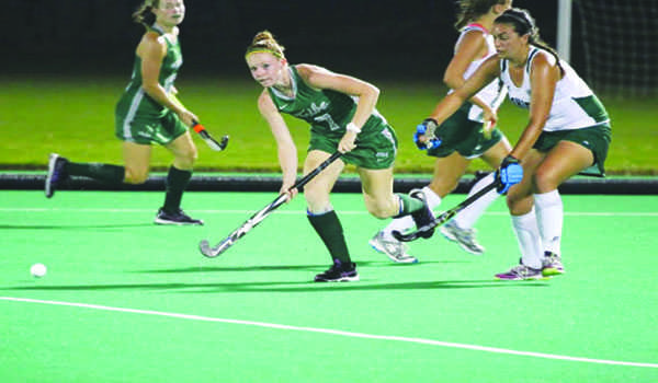 Jenny McCann class of 2015, plays forward for William and Mary. She runs to the ball during her game. 
