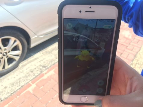 Student prepares to capture a Drowzee, one of the various Pokemon Go characters