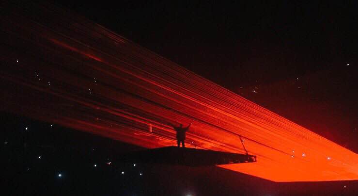 Kanye West reaching out for the crowd during Fade