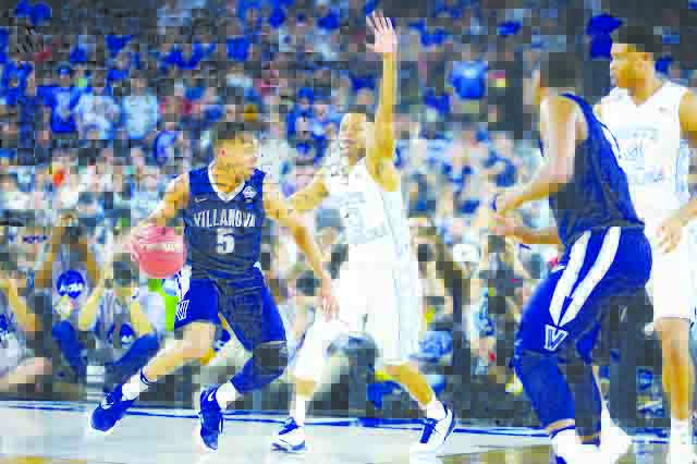 Junior, Phil Booth, drives the lane against a North Carolina defender in last years NCAA championship game where Villinova won on a last second three pointer to win the game 77-74