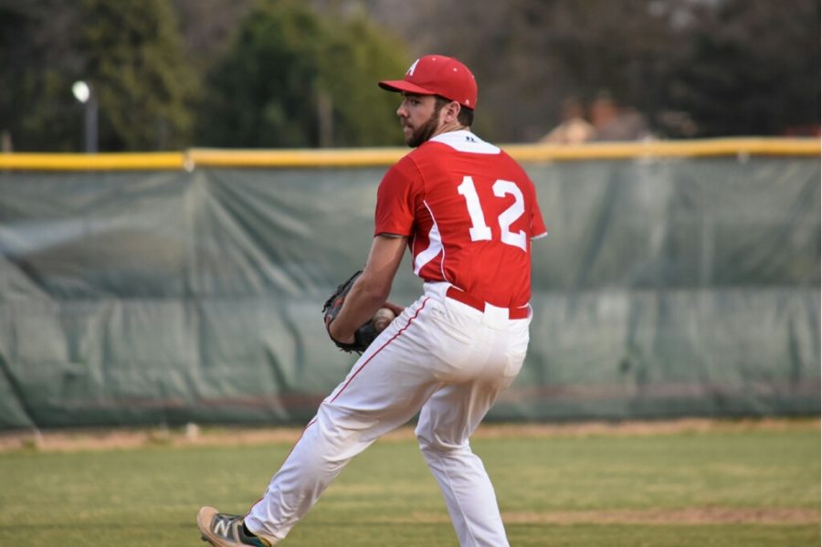 Sophomore Alex Brennan pitches during a game. 