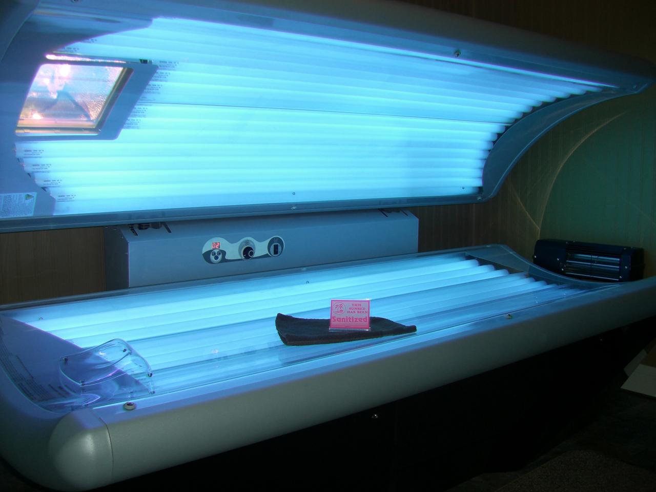 The U.S. Centers for Disease Control and Prevention says that half as many high school students use indoor tanning beds now compared to the amount reported in 2009.