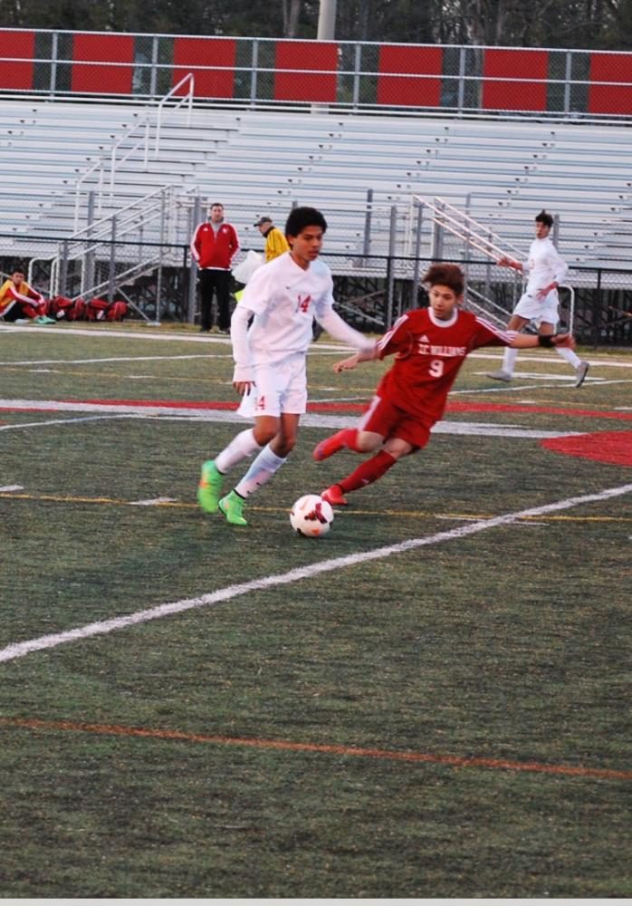 Junior Rudy Flores competes in a soccer match against the T.C. Williams Titans on March 27. 