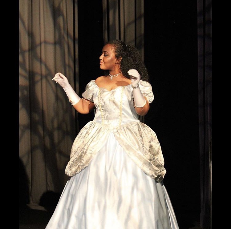 Senior HidayaHussen plays the fairygodmother  in the 2017 spring production of Cinderella. 