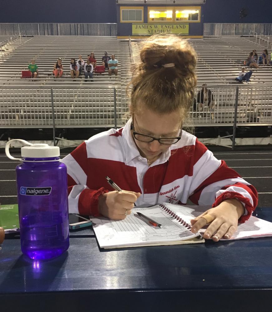 Senior field hockey manager Lydia Peters book keeps during a game against the Lee Lancers on Sept. 19.