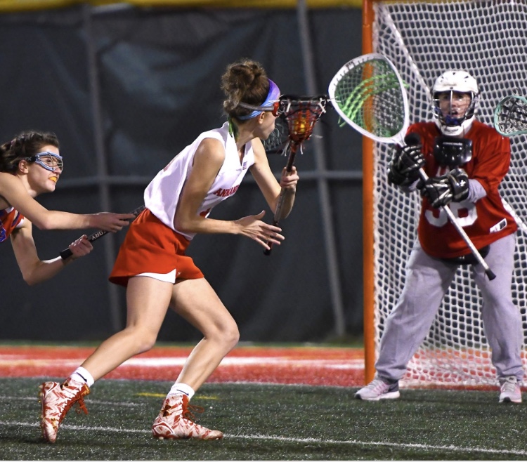 Senior Melissa Wilson winds up to take a shot at the goal in a lacrosse game last season. 