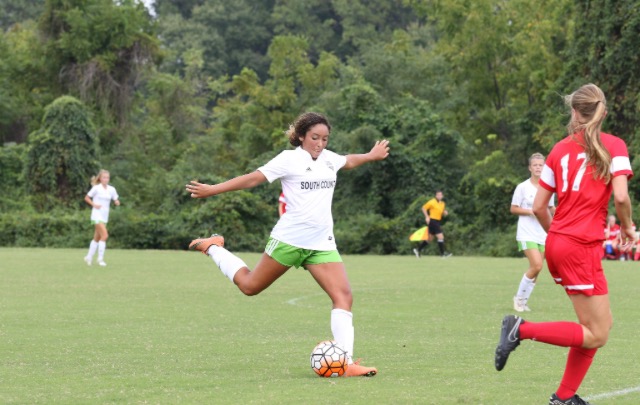 Anissa Cheikh winds up take a free kick in a game for her SCAA travel team. Cheikh competes in soccer both in school as well as for a team outside of school. 