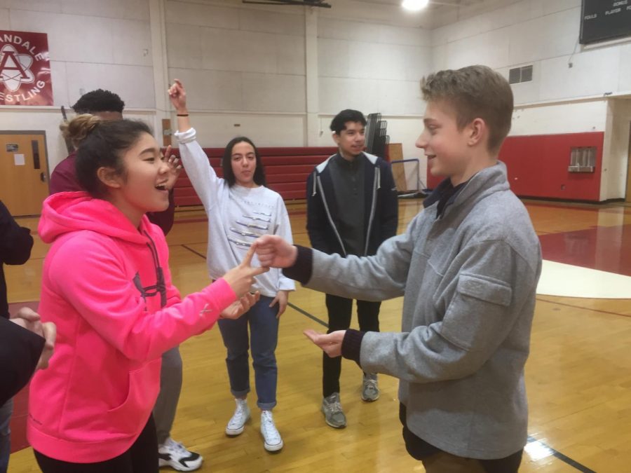 Fellowship of Christian Athletes members McKenzie Yi (Left) and Nate Peters (Right) play in a game of rock, paper, scissors during a meeting on Jan. 19. 