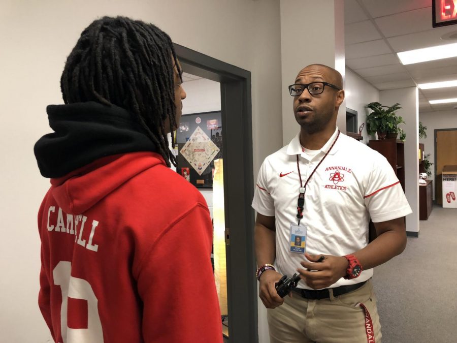 Assistant principal Brian Valentine and freshman Shyeim Campbell talked over how Campbell AHS’s sponsored sweatshirt after the treacherous work for football.