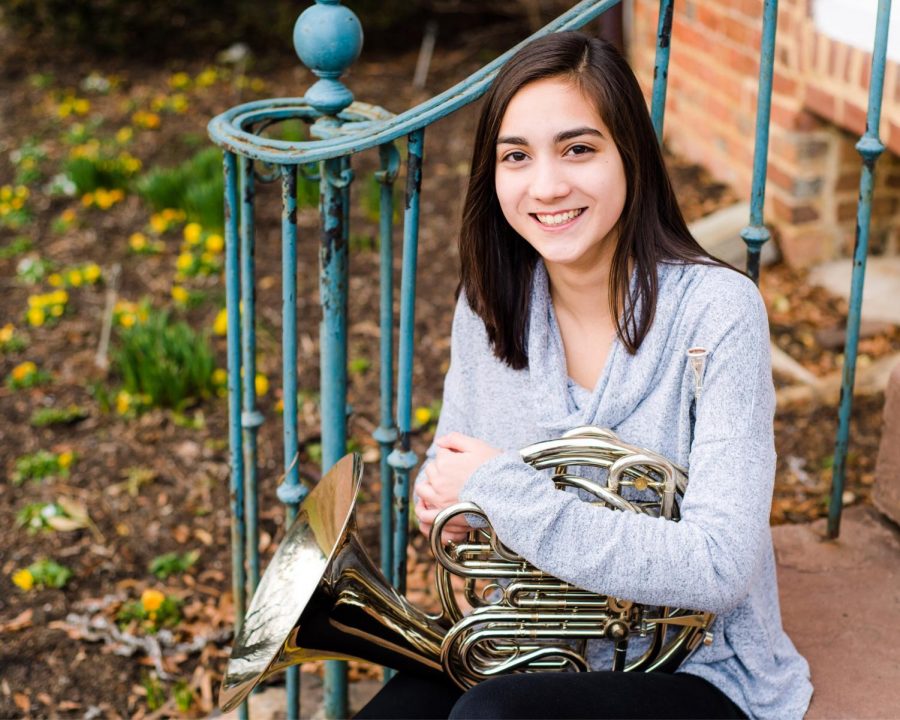 Junior Gaby Pho holds the instrument that got her a full ride to Julliard.