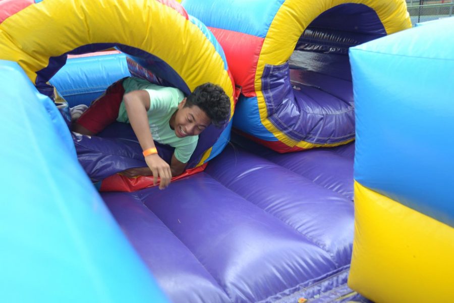 Junior Alessio Humerez attended the first AHS Summer Fest last school year. One of the many attractions of the festival are inflatable slides.