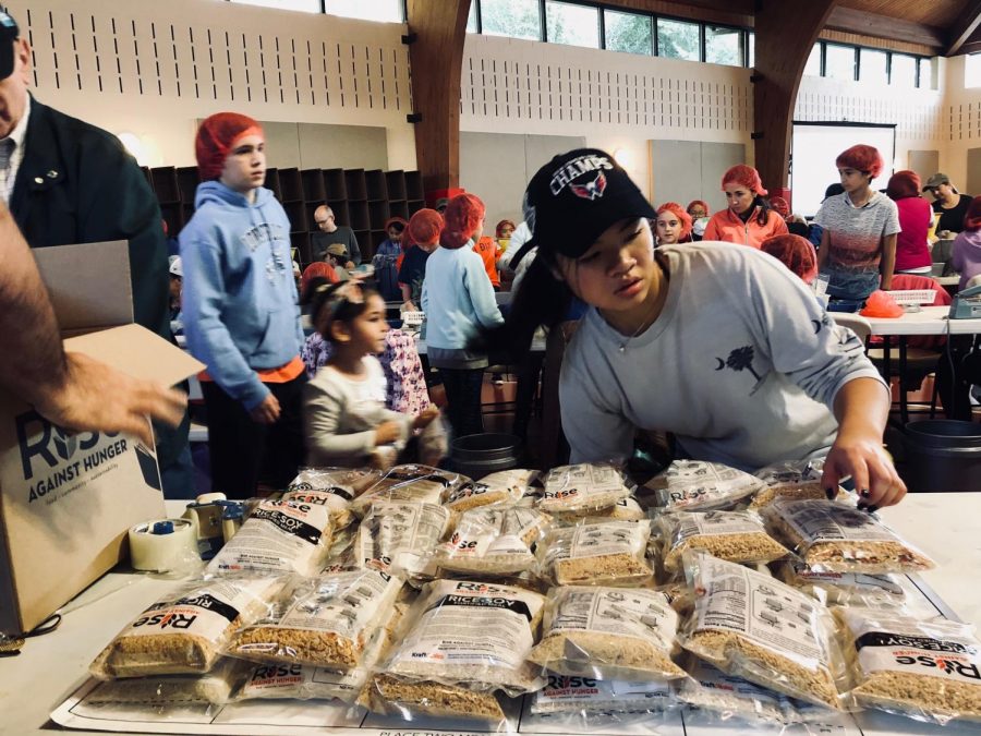 A Mission Possible member participates in the meal packaging event hosted by Rise Against Hunger on Nov. 3.  