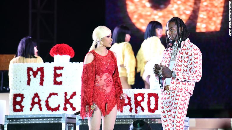 LOS ANGELES, CALIFORNIA - DECEMBER 15: Singer Cardi B (L) is presented a Take Me Back card onstage by her husband Offset (R) during day 2 of the Rolling Loud Festival at Banc of California Stadium on December 15, 2018 in Los Angeles, California. (Photo by Scott Dudelson/Getty Images)