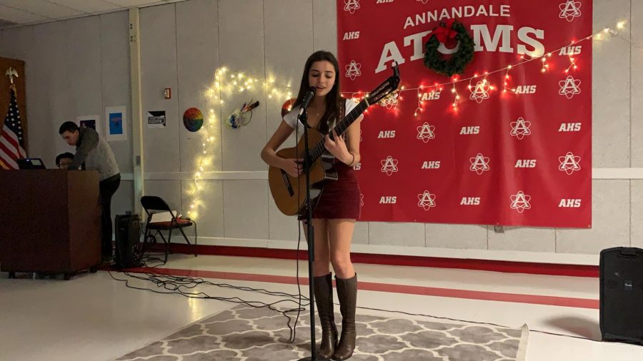 Junior Elvera Miller performs the songs “Untitled” and “Between the Bars” at the Winter Coffee House on Dec. 12. 