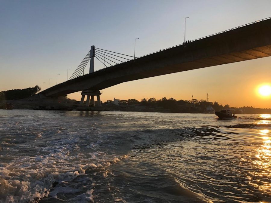 Barua crosses a bridge while on a speed boat tour given by the Bangladeshi Navy. 